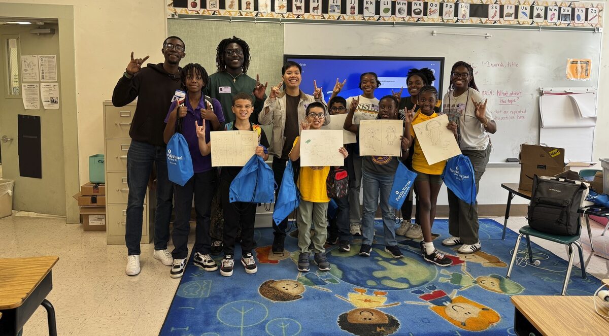 USF NSBE members teaching STEM to elementary students at Lomax