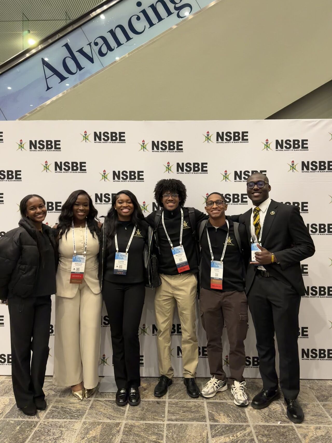 Members at NSBE step-and-repeat
